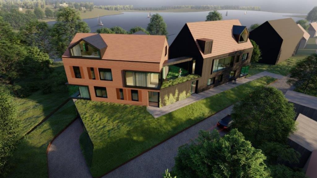 Koncepcja apartamentowca z widokiem na jezioro Ukiel